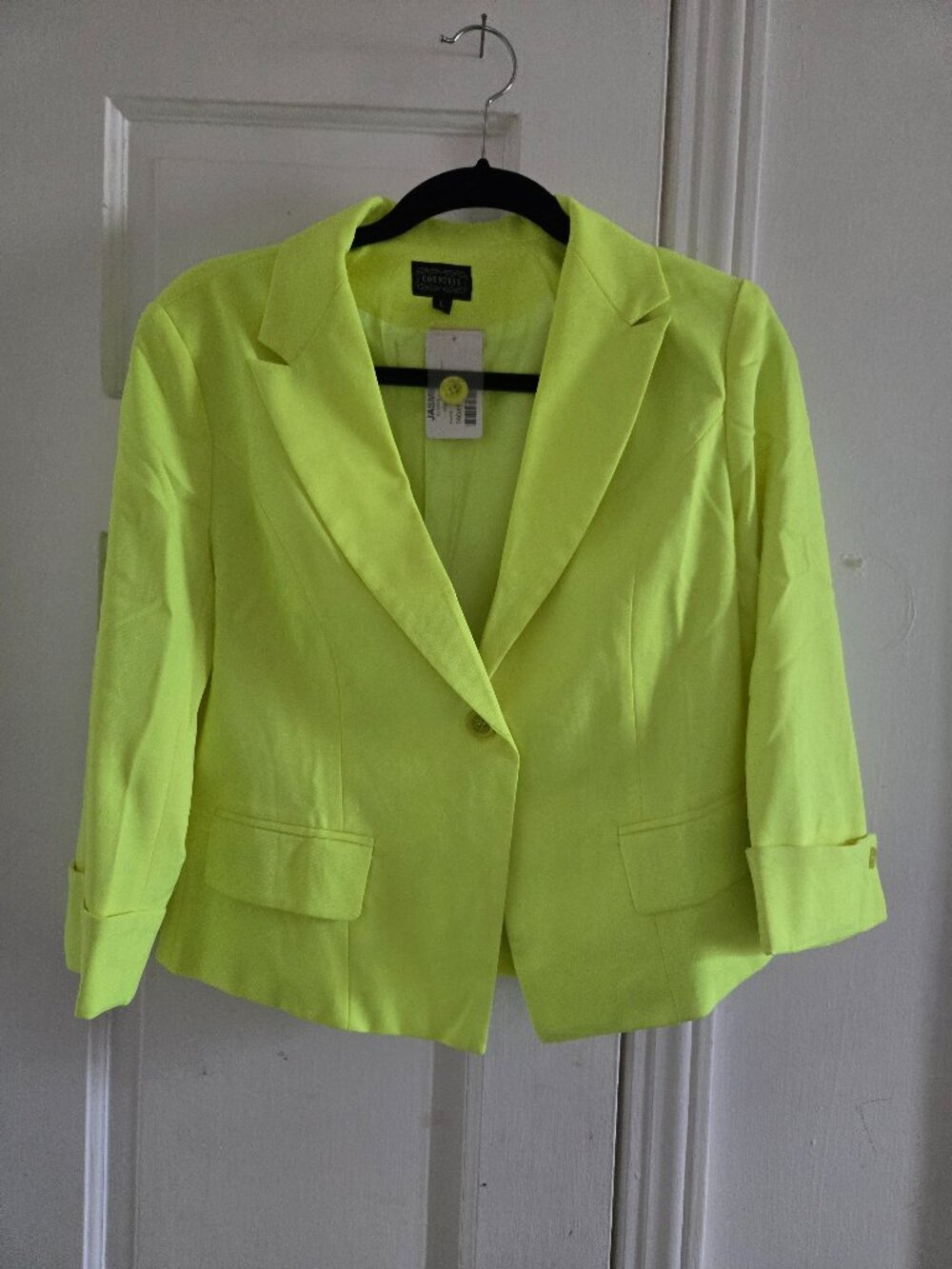 bright neon yellow fitted blazer with three-quarter length sleeves and a single